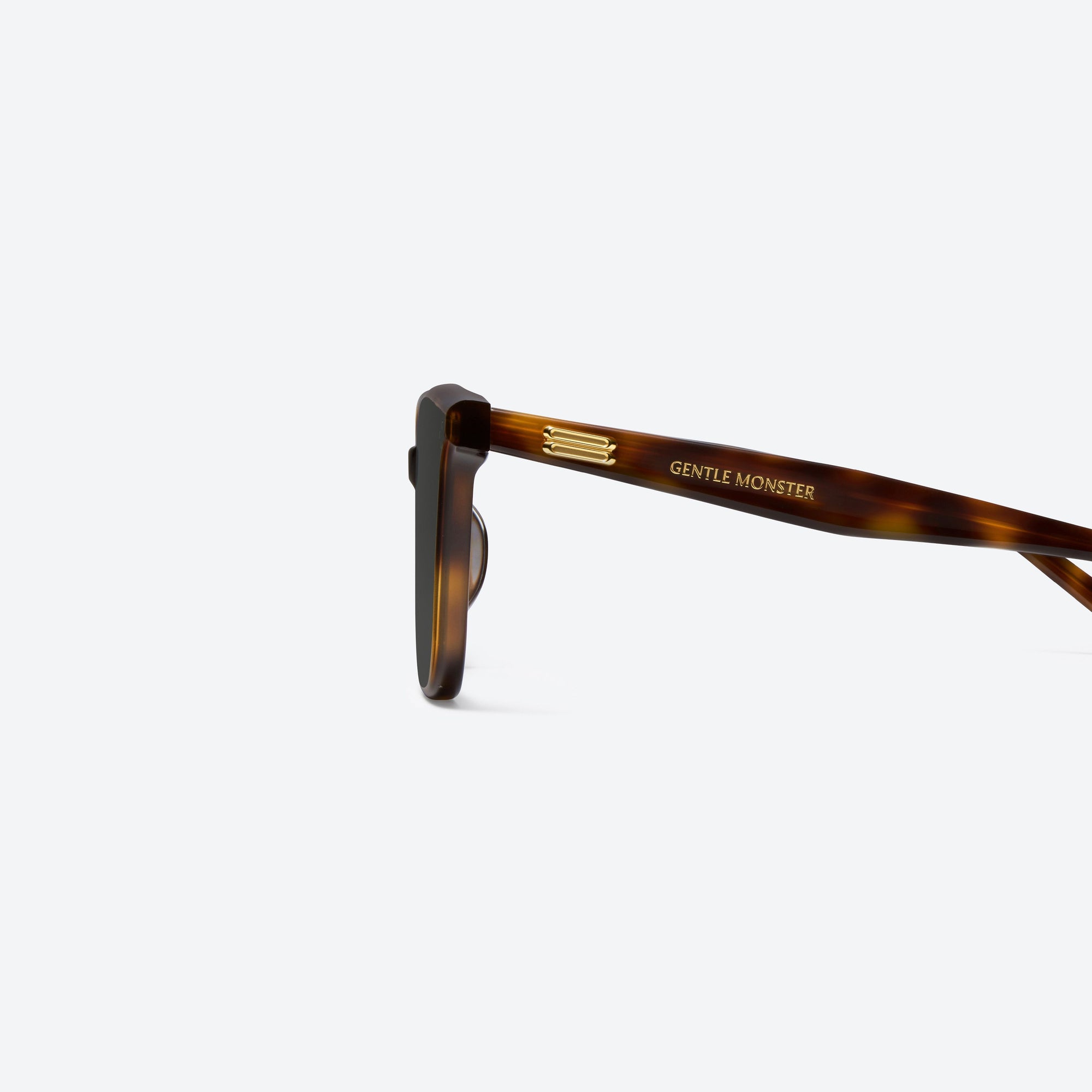A detailed left view of Gentle Monster Lo Lou L2 Tortoise Acetate framed Square sunglasses.