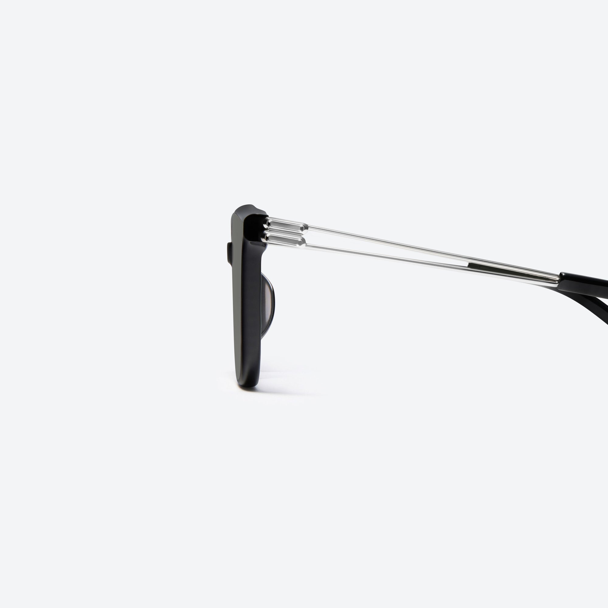 A detailed left view of Gentle Monster La Sola 01 Black Mixed framed Square sunglasses.