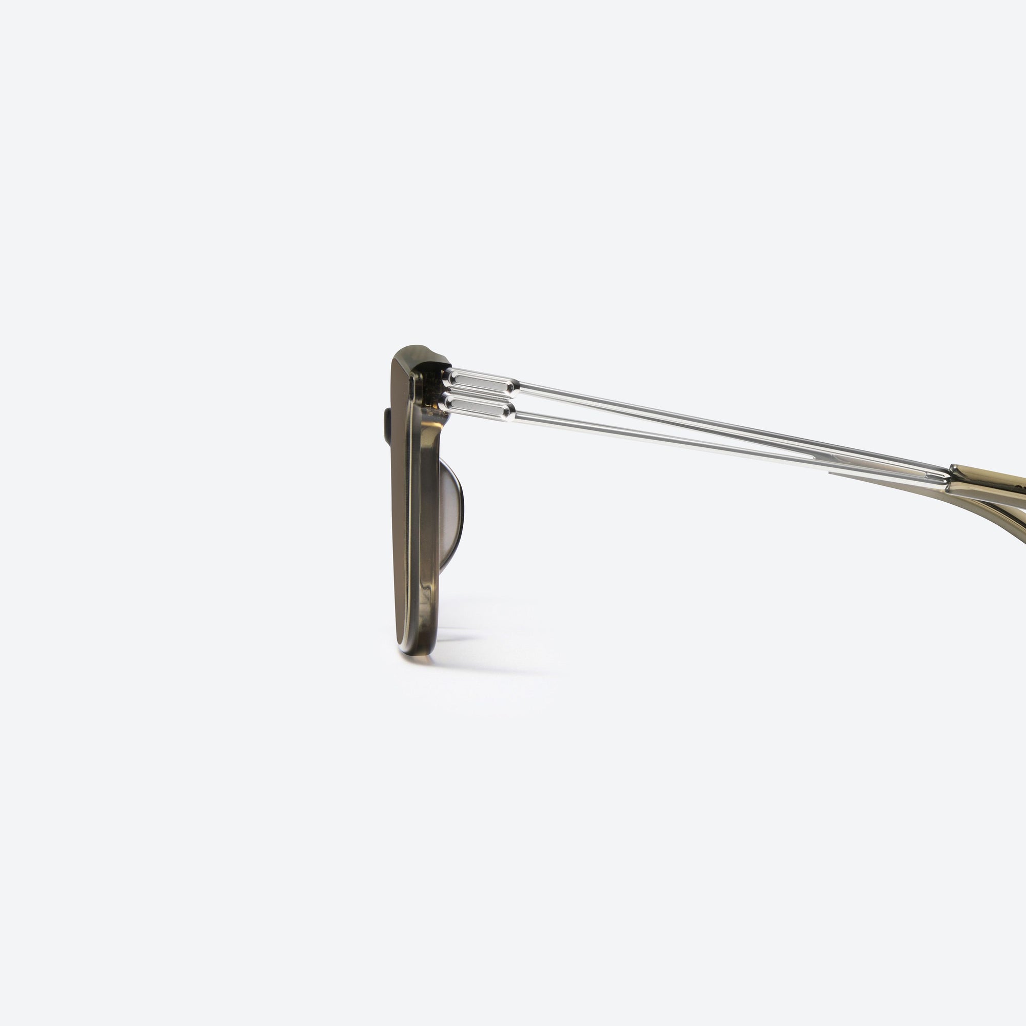 A detailed left view of Gentle Monster La Sola KC6 Green Mixed framed Square sunglasses.