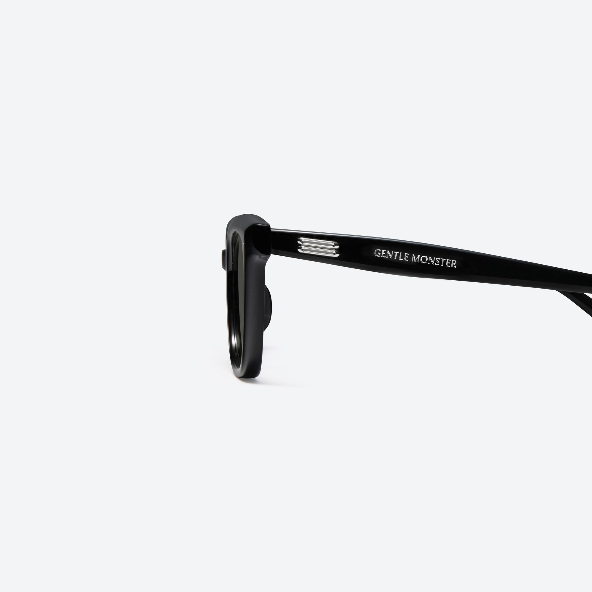A detailed left view of Gentle Monster Soho 01 Black Acetate framed Square sunglasses.