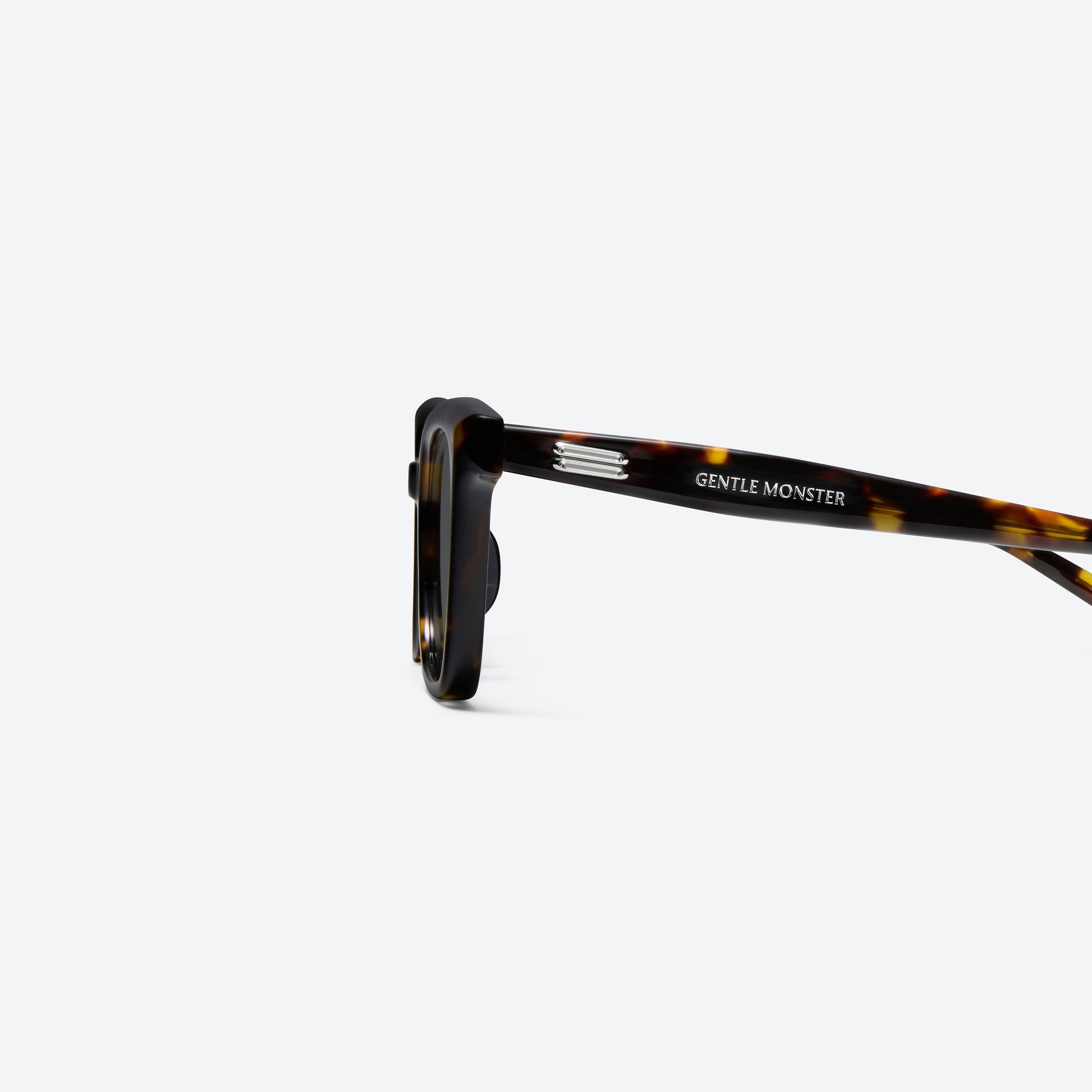 A detailed left view of Gentle Monster Soho T1 Tortoise Acetate framed Square sunglasses.