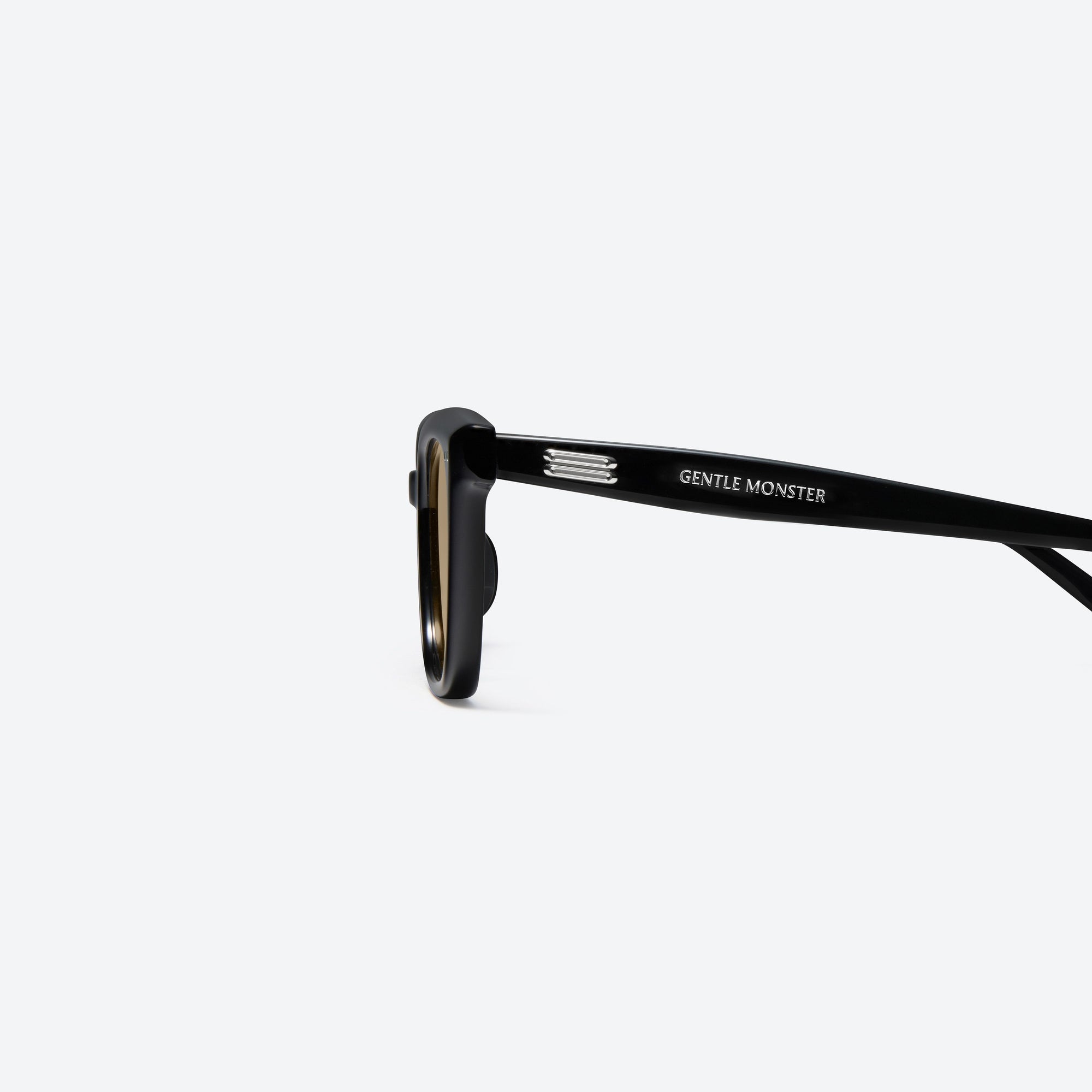 A detailed left view of Gentle Monster Soho 01(BR) Black Acetate framed Square sunglasses.
