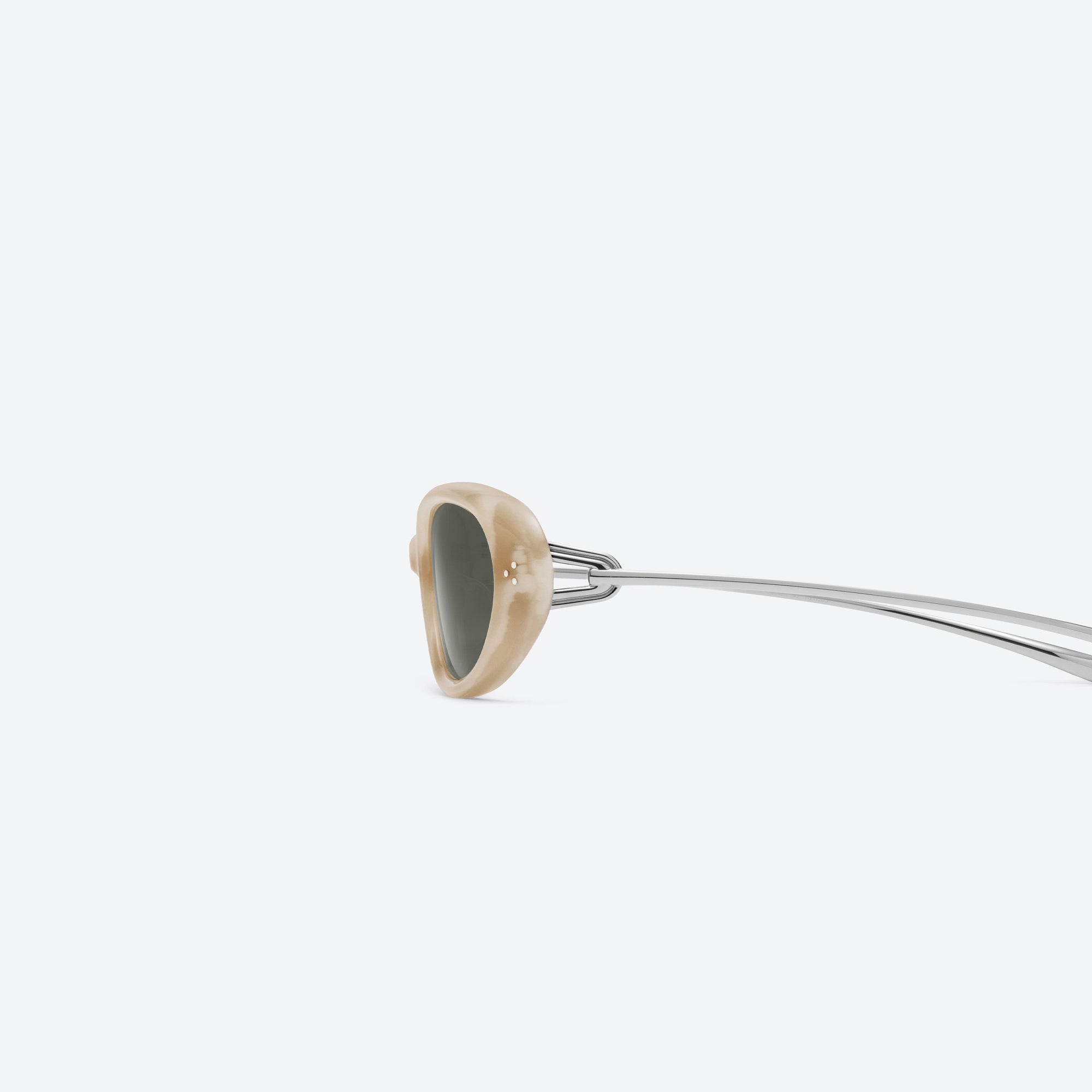 A detailed left view of Gentle Monster Ora IVD1 Ivory Mixed framed Oval sunglasses.