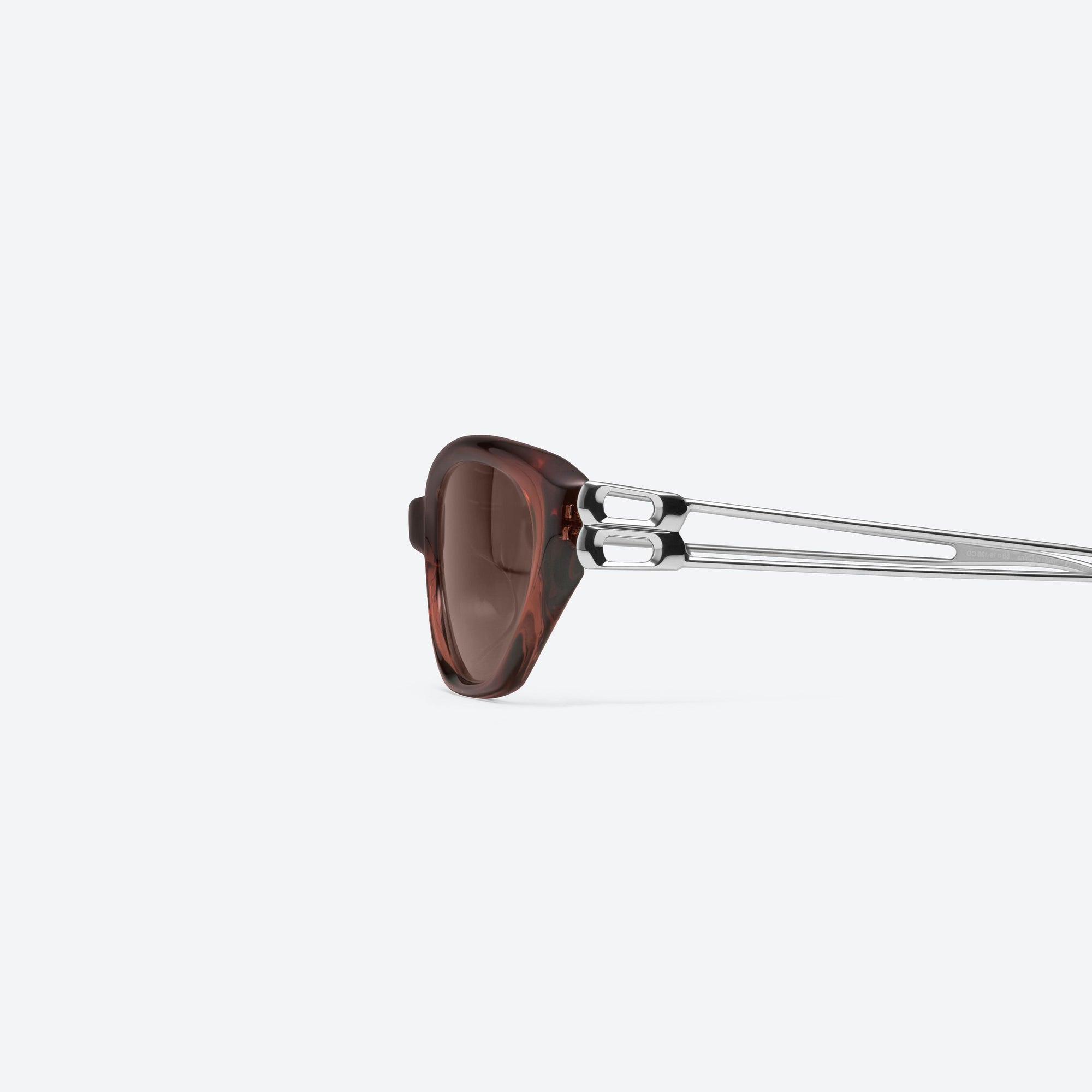 A detailed left view of Gentle Monster Mimosa BRC22 Brown Mixed framed Cat-eye sunglasses.