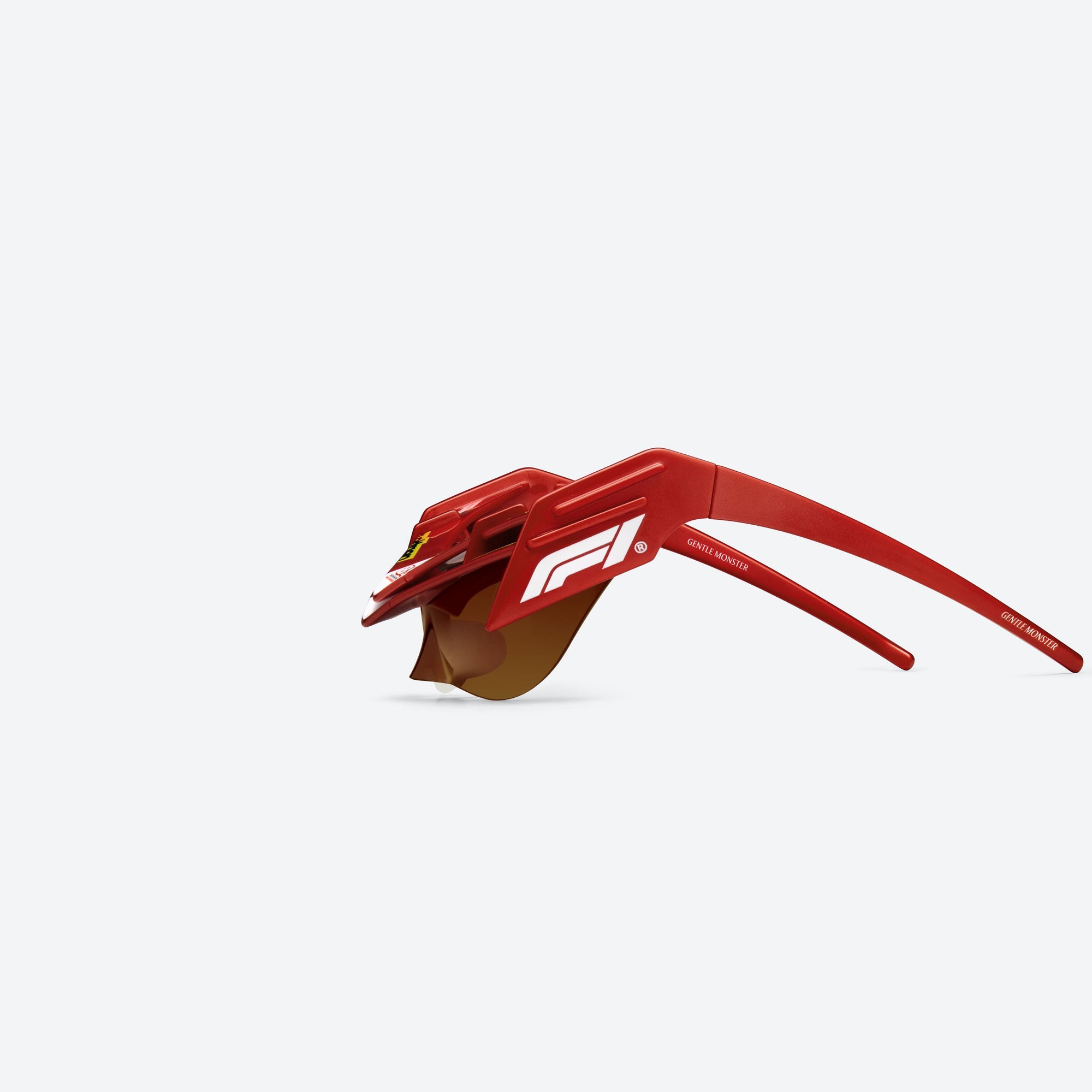 A detailed left view of Gentle Monster Disney F1 - Wing 4 R13 Red Nylon framed Wraparound sunglasses.
