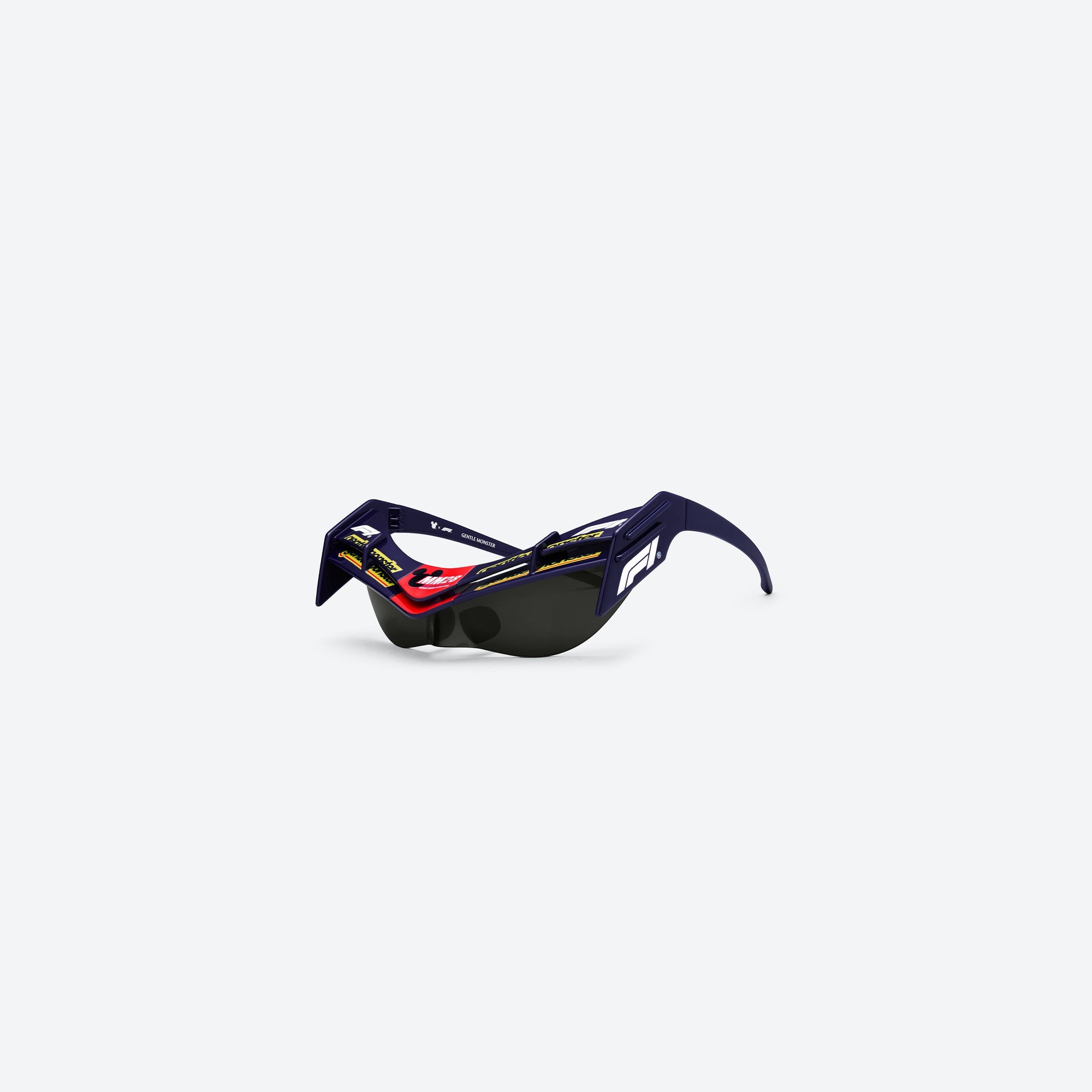 45-degree view of Gentle Monster Disney F1 - Wing 4 N8 Blue Nylon framed Wraparound sunglasses.