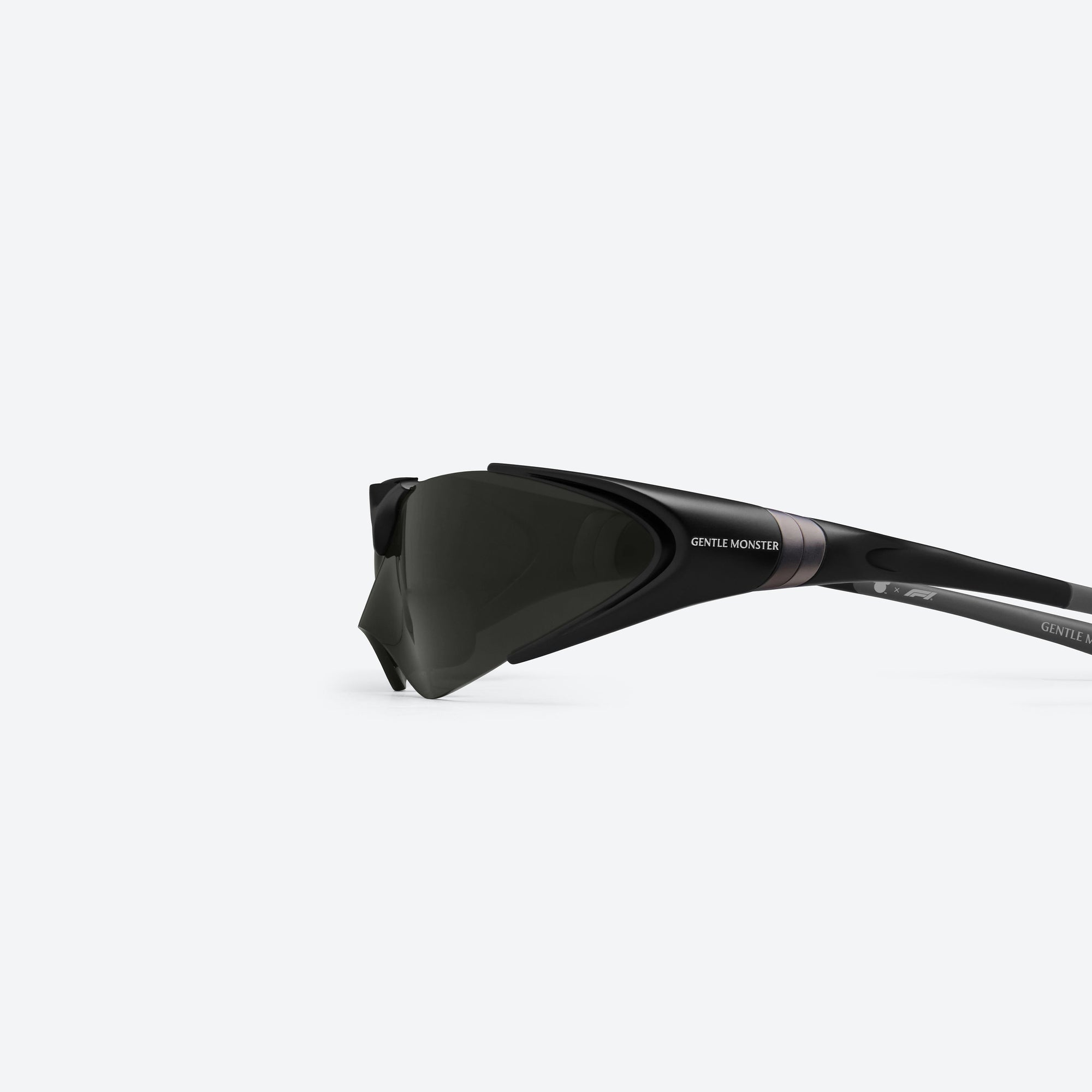 A detailed left view of Gentle Monster Disney F1 - Aero M01 Black Nylon framed Wraparound sunglasses.