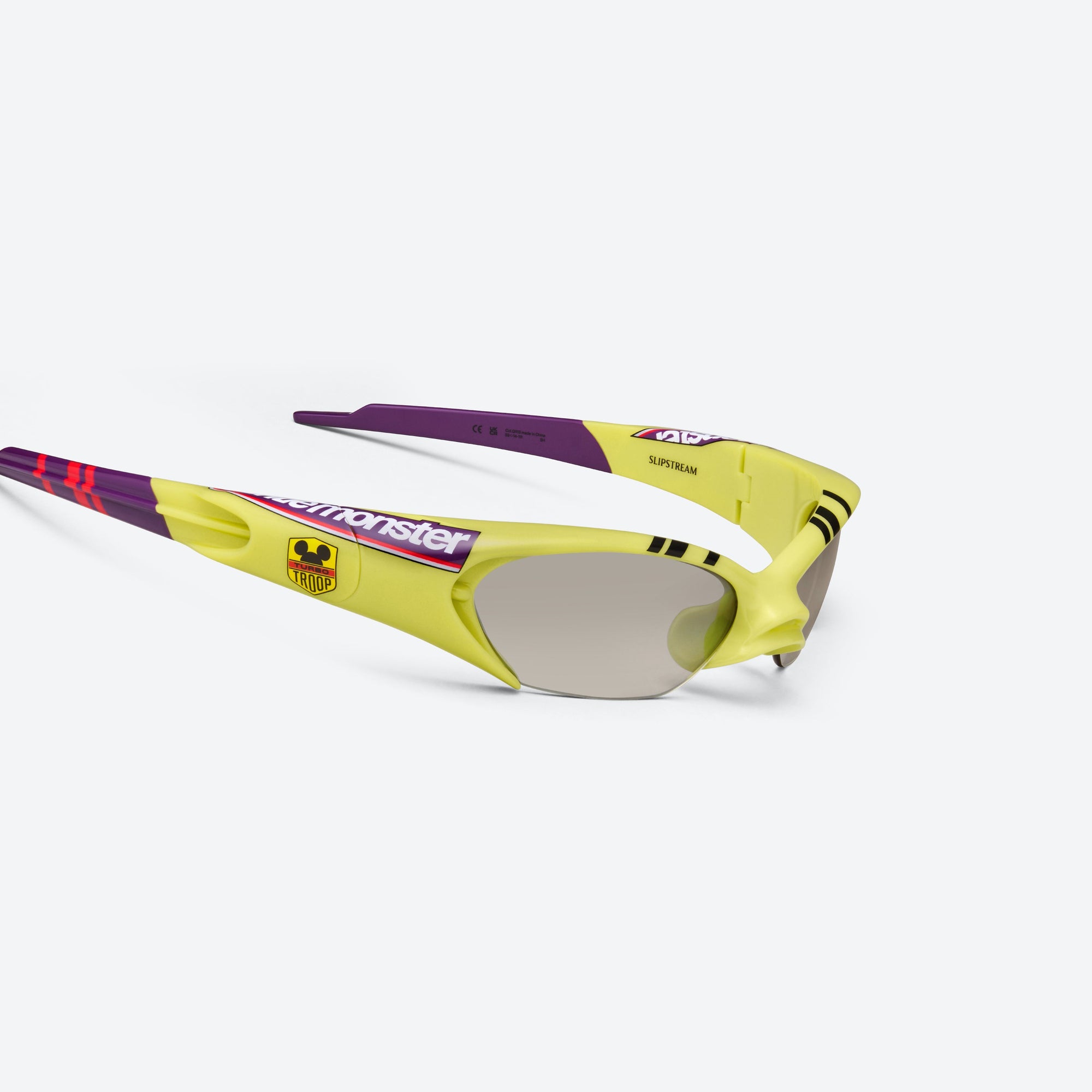 45-degree detailed view of Gentle Monster Disney F1 - Slipstream GR13 Green Nylon framed Wraparound sunglasses.