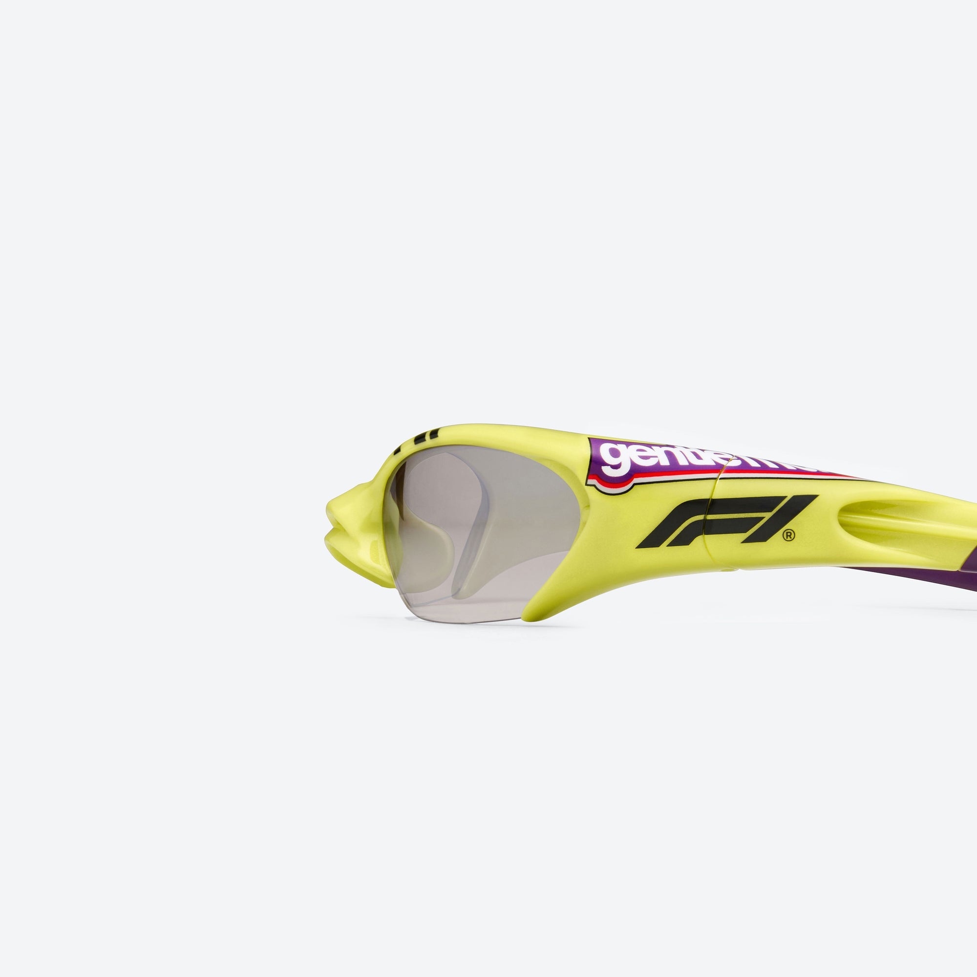 A detailed left view of Gentle Monster Disney F1 - Slipstream GR13 Green Nylon framed Wraparound sunglasses.