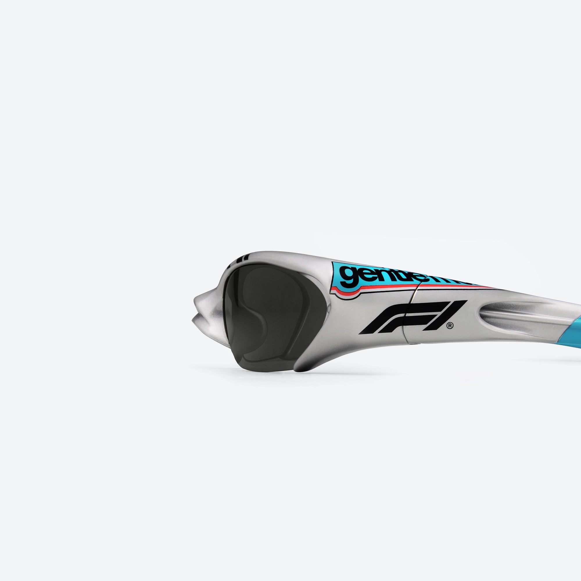 A detailed left view of Gentle Monster Disney F1 - Slipstream G21 Gray Nylon framed Wraparound sunglasses.