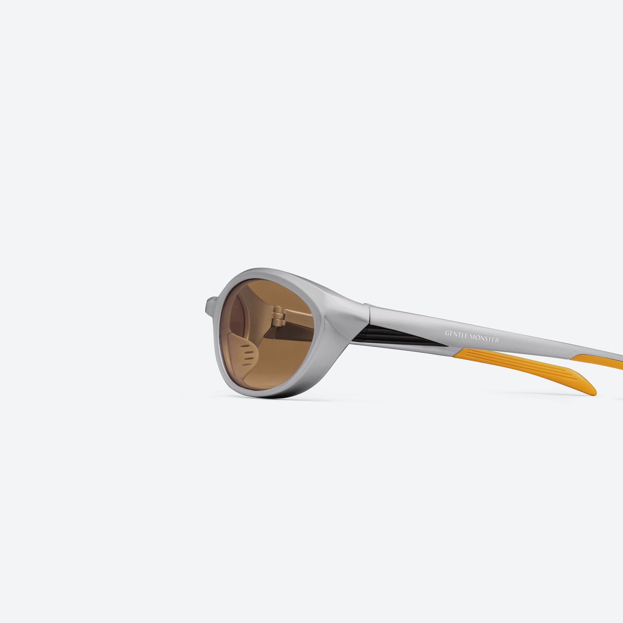 A detailed left view of Gentle Monster Rim MG22 Gray Nylon framed Wraparound sunglasses.