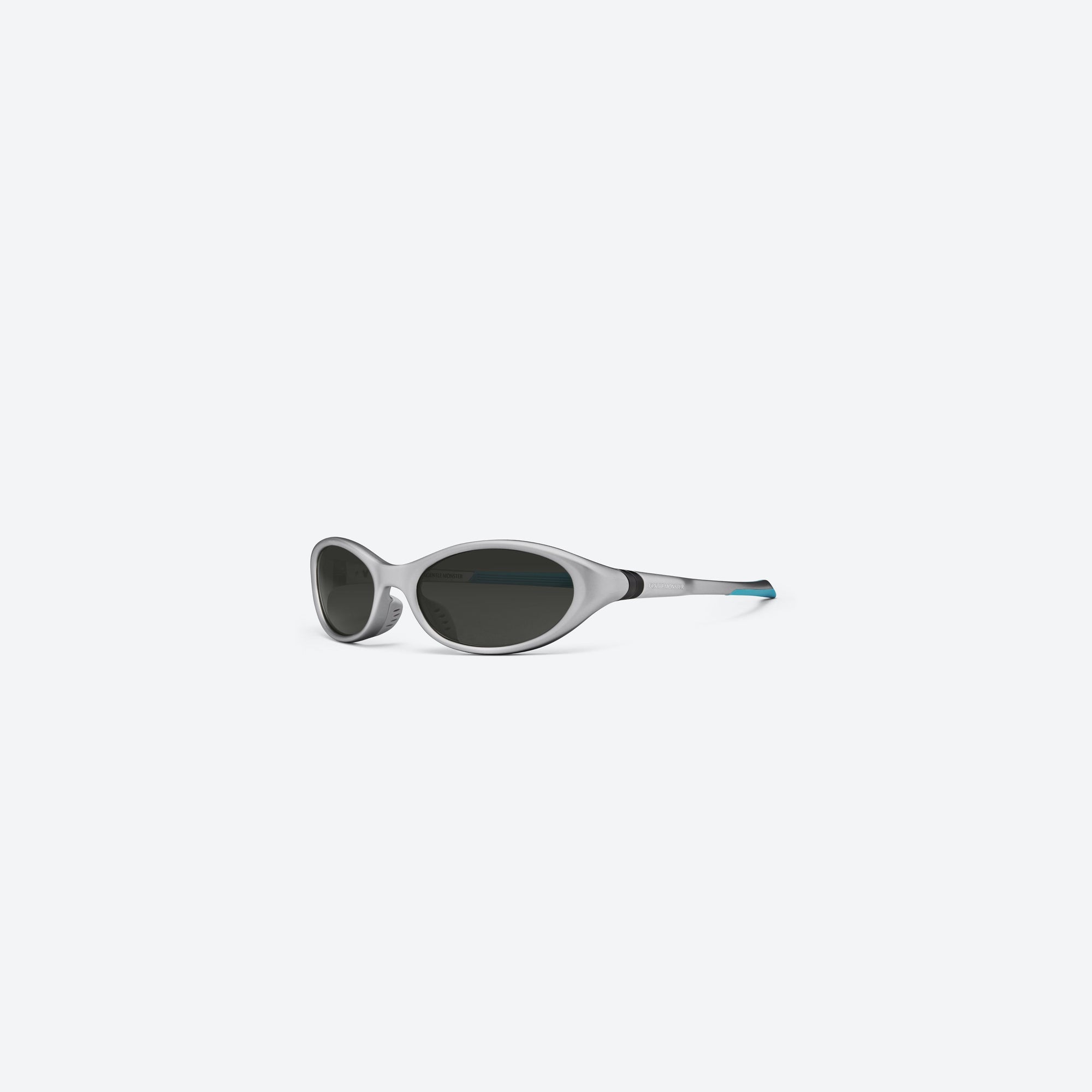 45-degree view of Gentle Monster Disney F1 - Velo MG21 Gray Nylon framed Wraparound sunglasses.