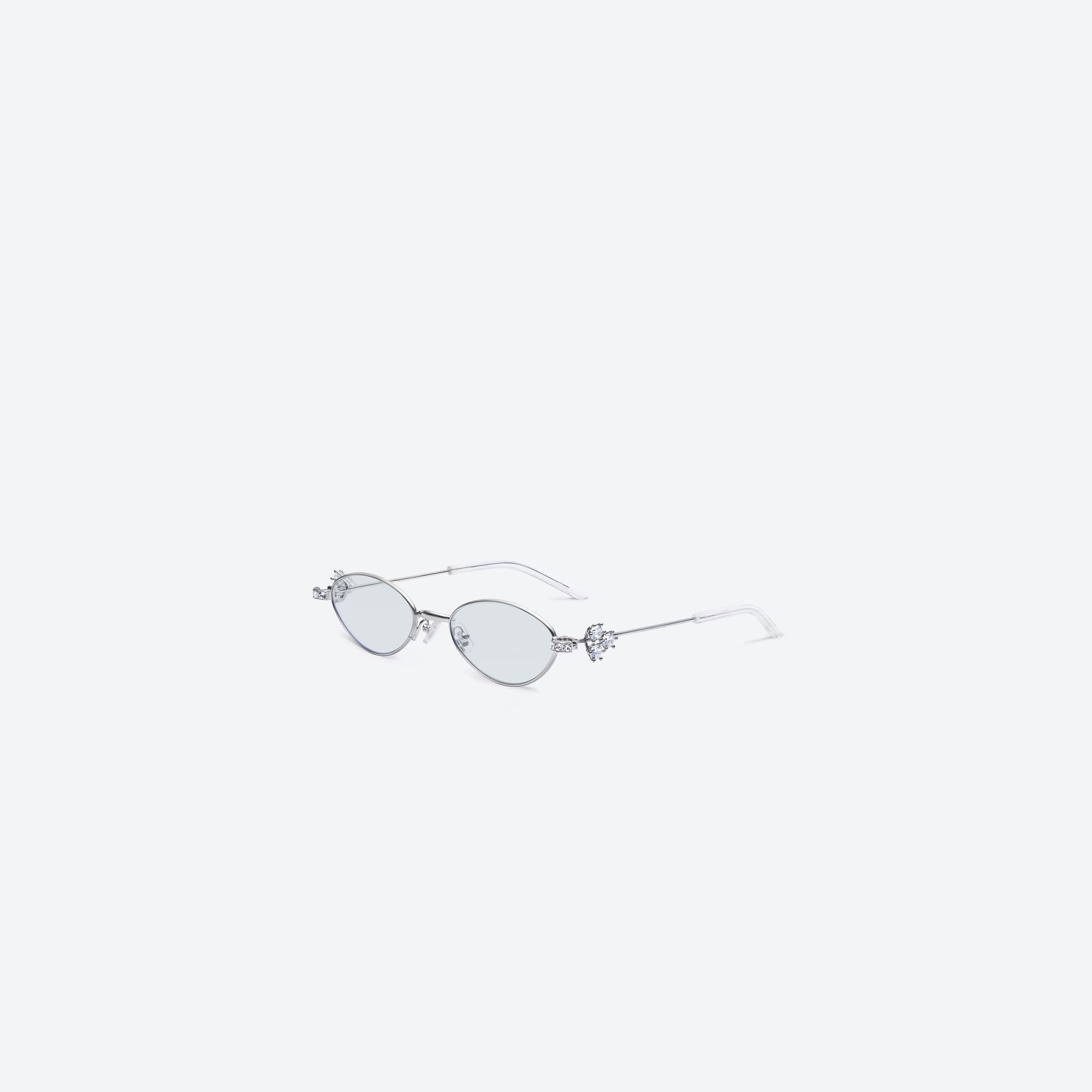 45-degree view of Gentle Monster Carat 02(GR) Silver Metal framed Oval sunglasses.