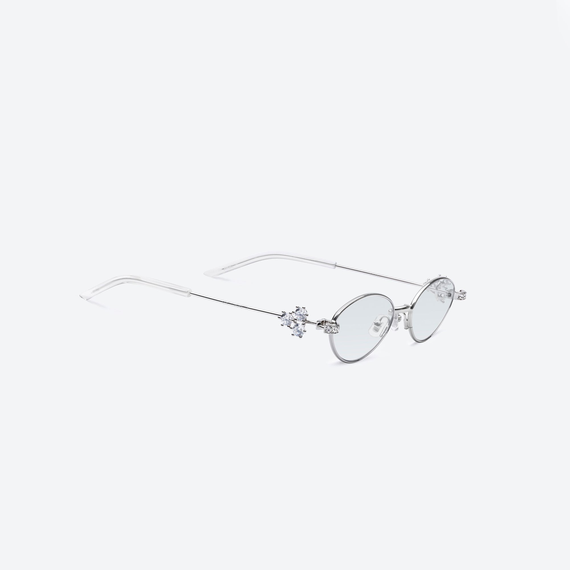 45-degree detailed view of Gentle Monster Carat 02(GR) Silver Metal framed Oval sunglasses.