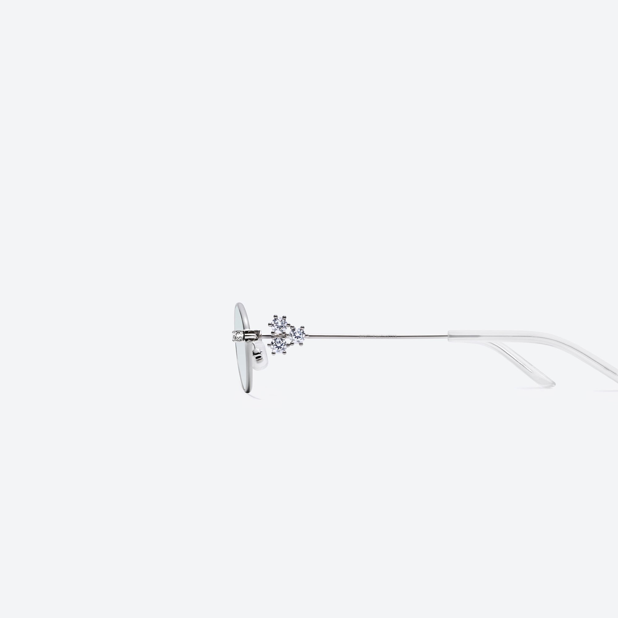 A detailed left view of Gentle Monster Carat 02(GR) Silver Metal framed Oval sunglasses.