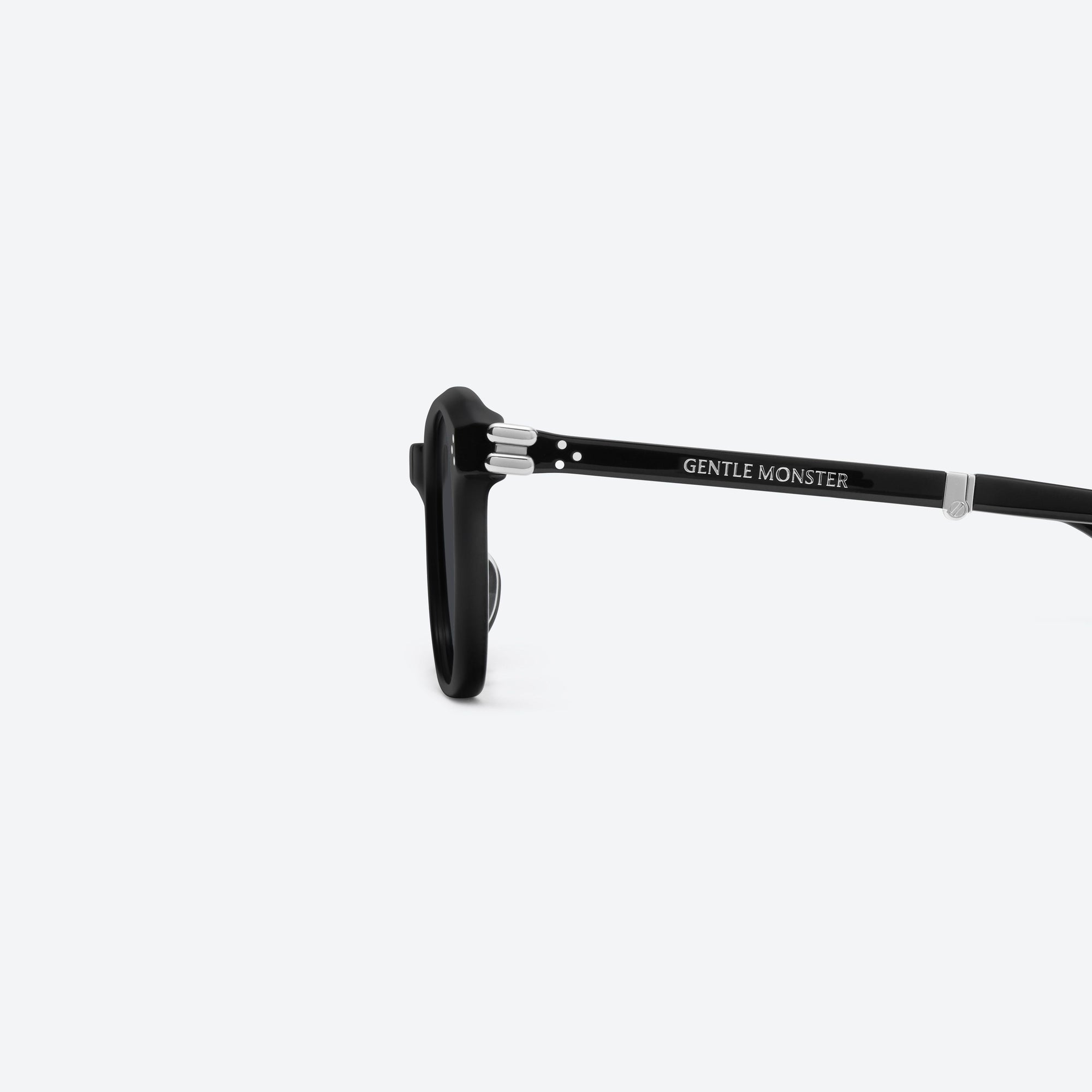 A detailed left view of Gentle Monster Jasmin 01 Black Acetate framed Square sunglasses.