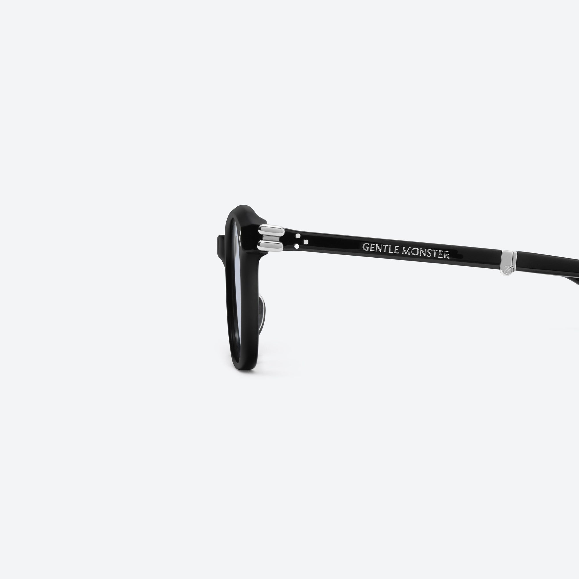 A detailed left view of Gentle Monster Jasmin 01(BL) Black Acetate framed Square sunglasses.