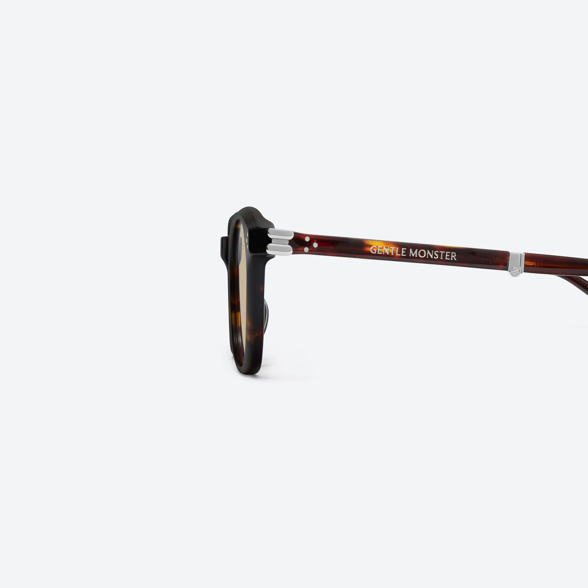 A detailed left view of Gentle Monster Jasmin T1 Tortoise Acetate framed Square sunglasses.