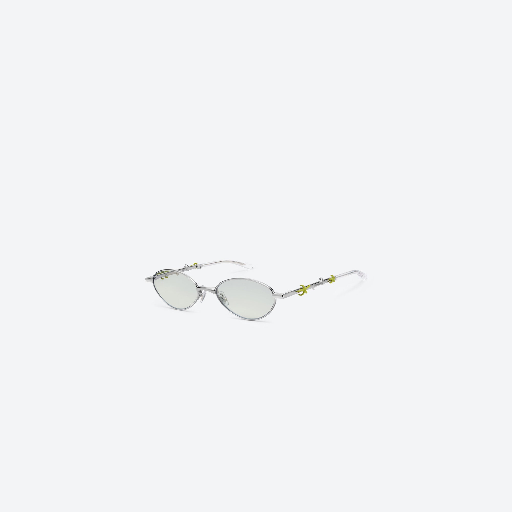 45-degree view of Gentle Monster Aden 02(GRM) Silver Metal framed Oval sunglasses.