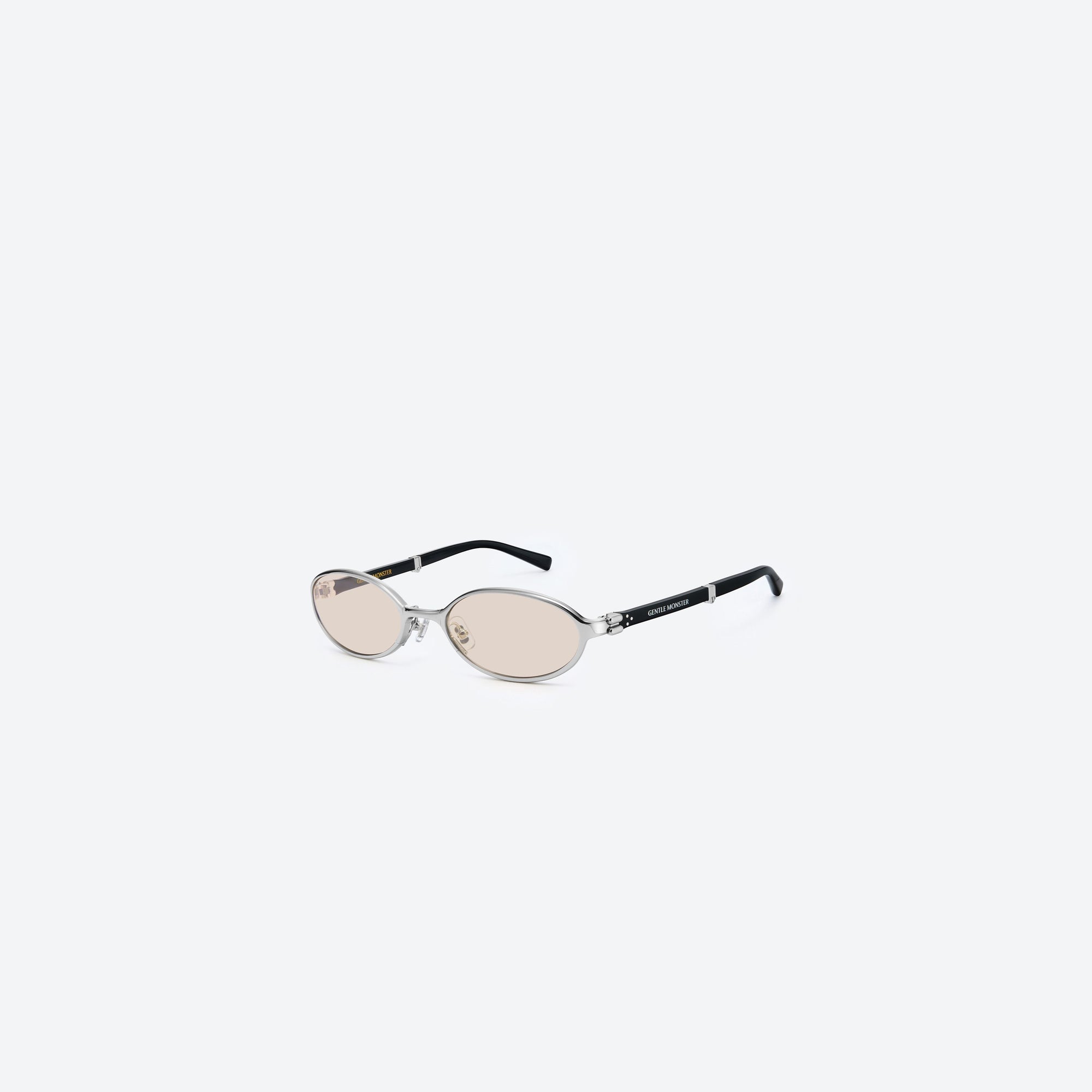 45-degree view of Gentle Monster Oatt 02 Silver Mixed framed Oval sunglasses.
