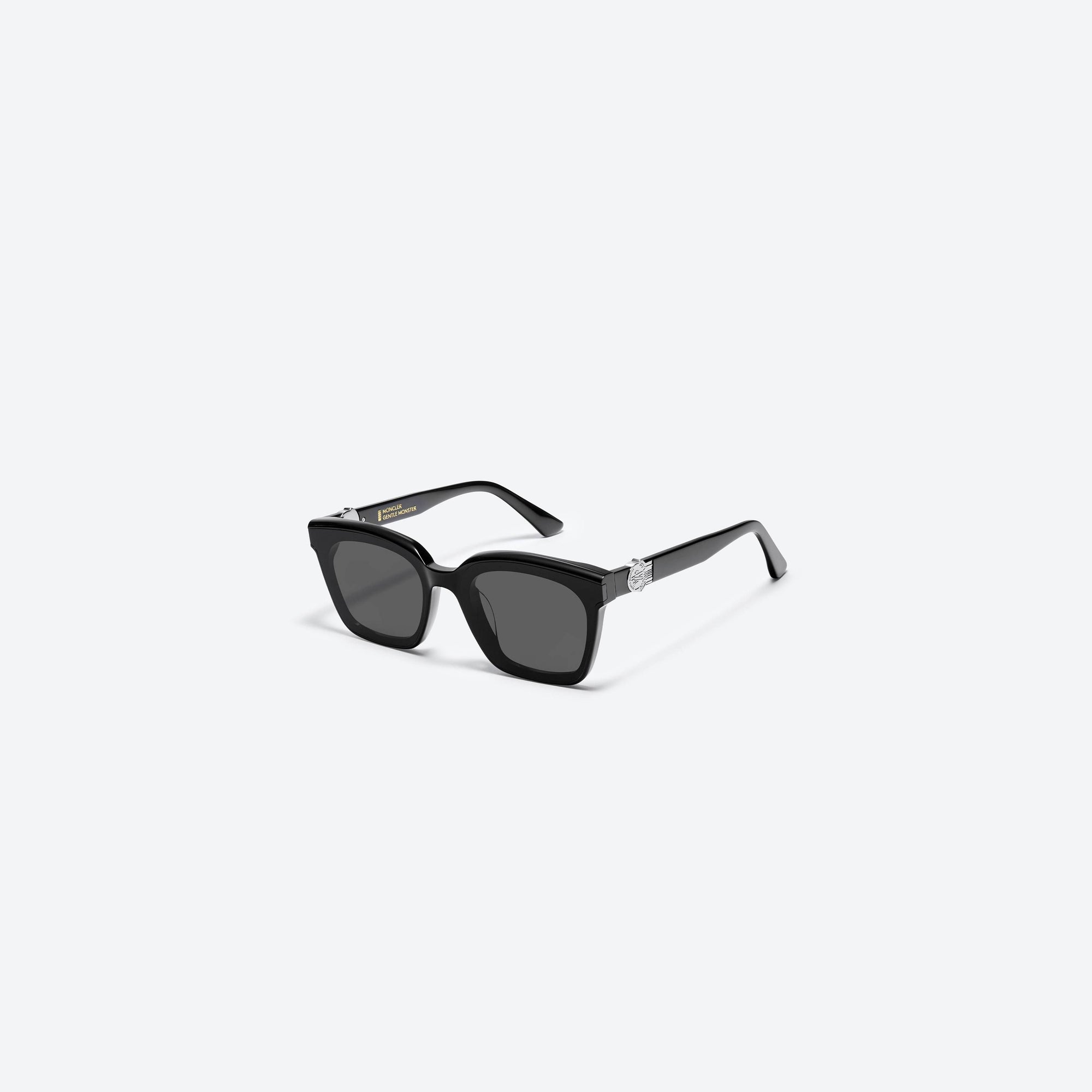 45-degree view of Gentle Monster Moncler - Swipe 3 01 Black Mixed framed Square sunglasses.