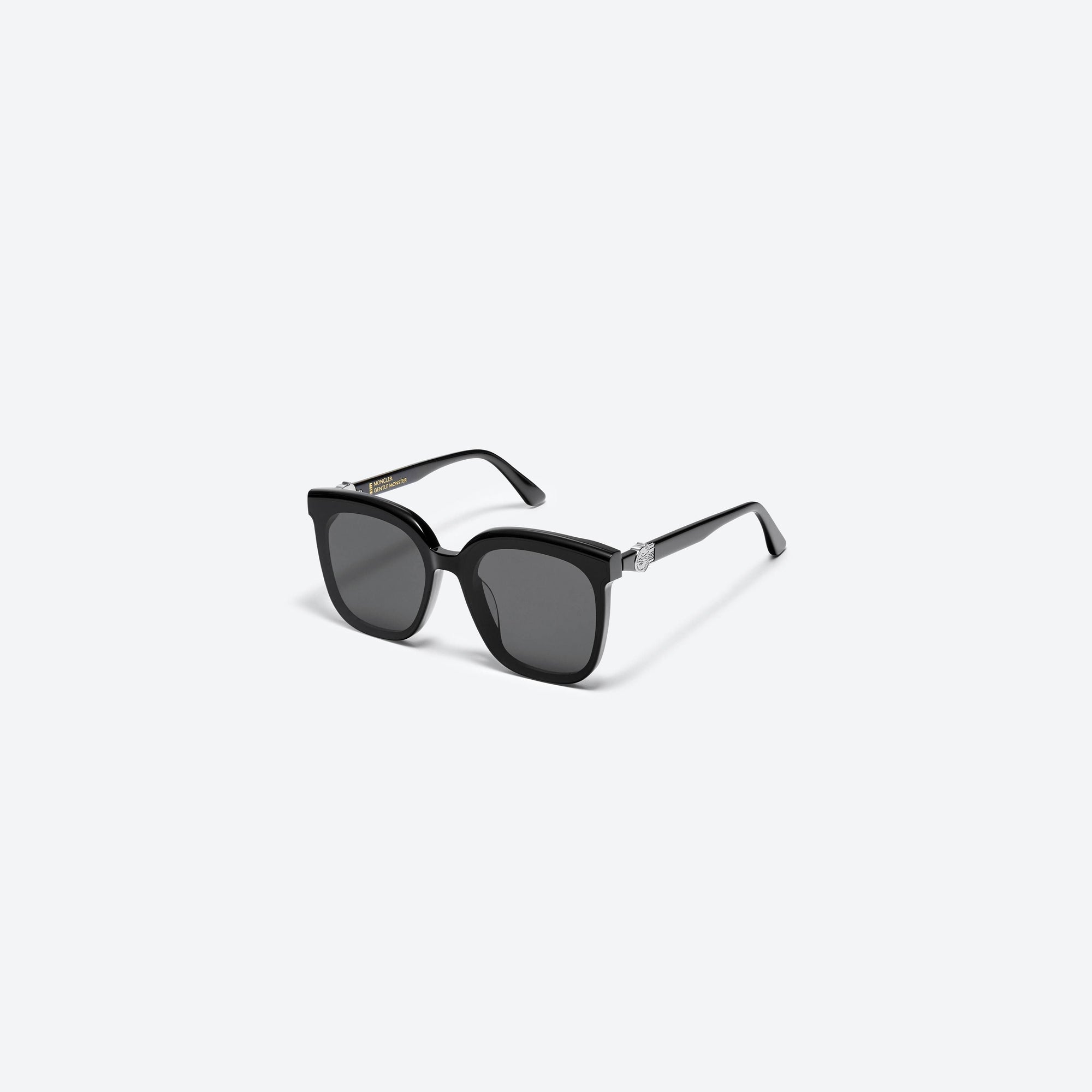 45-degree view of Gentle Monster Moncler - Swipe 4 01 Black Mixed framed Square sunglasses.