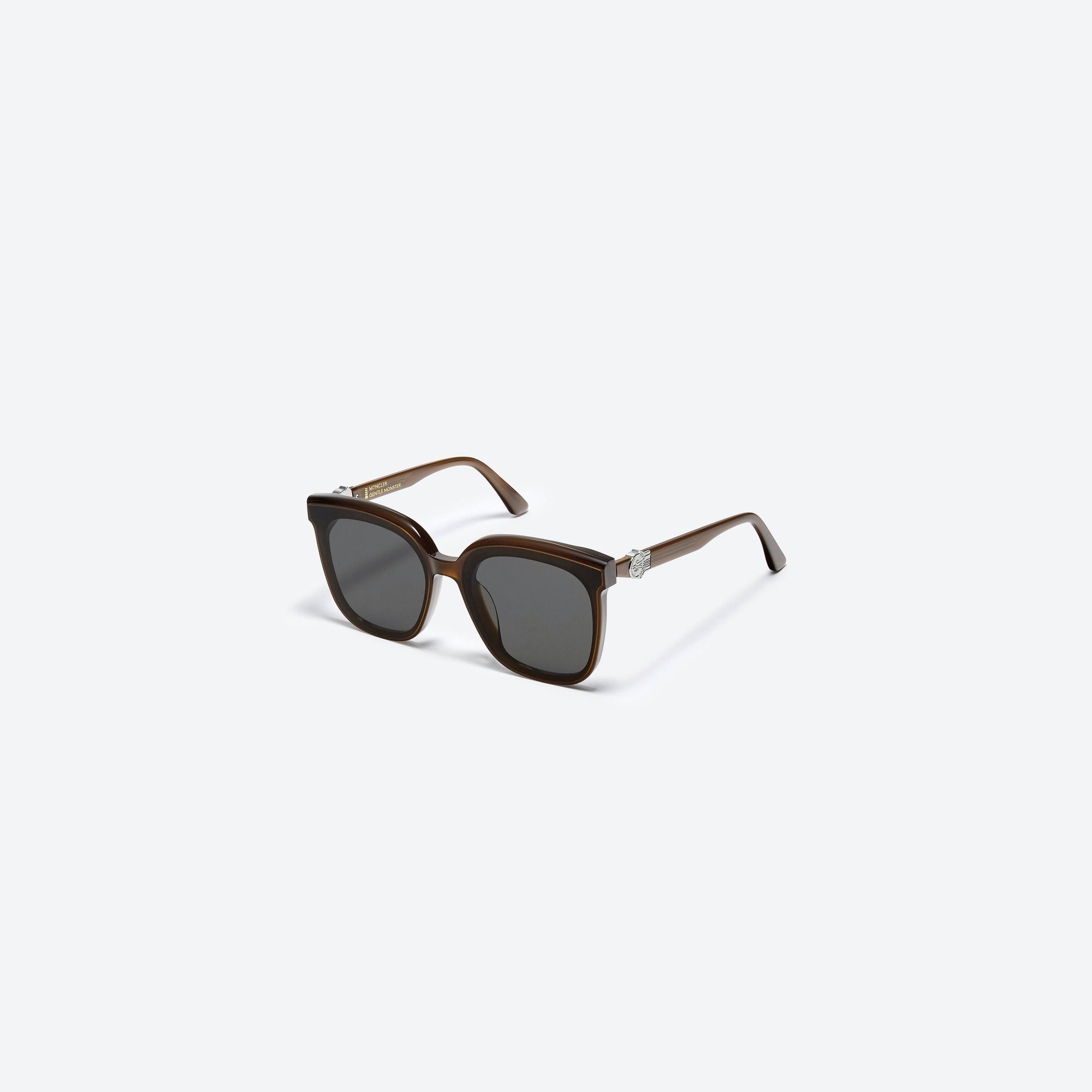 45-degree view of Gentle Monster Moncler - Swipe 4 DBC1 Brown Mixed framed Square sunglasses.