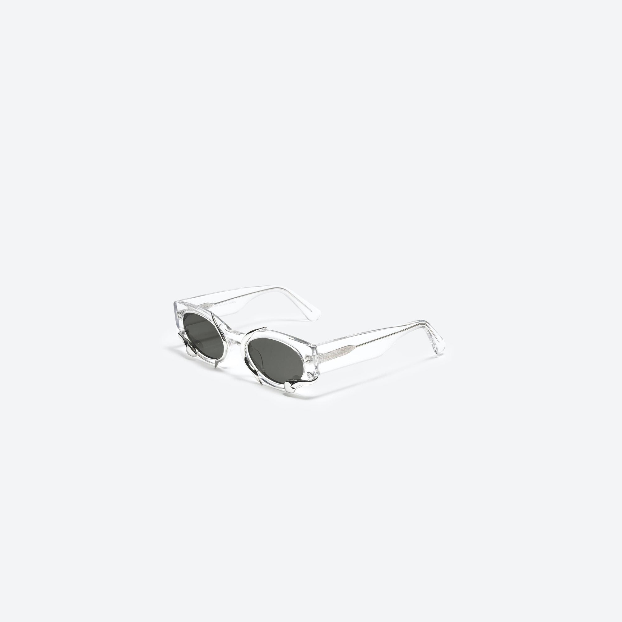 45-degree view of Gentle Monster Alexander Wang - M.pri C1 Clear Mixed framed Cat-eye sunglasses.
