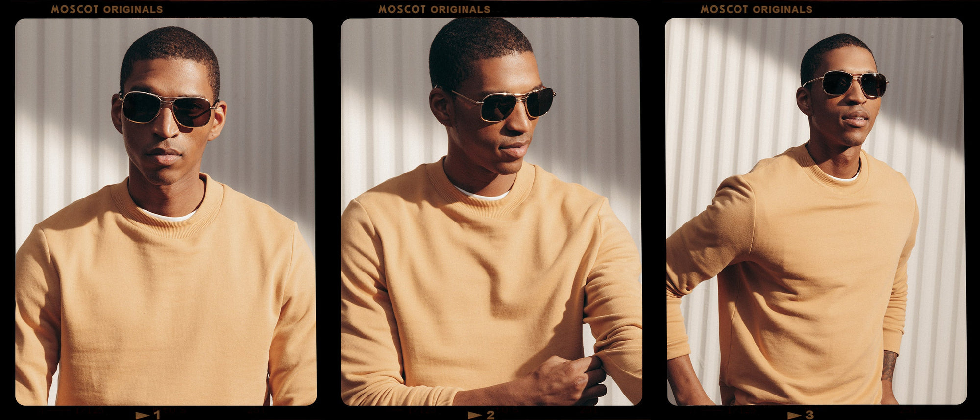Model is wearing The HELDISH SUN in Gold in size 57 with Cosmitan Brown Glass Lenses